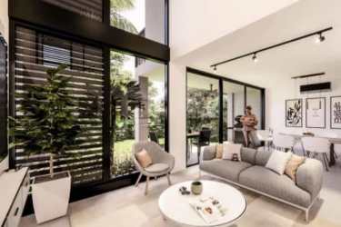 Terrace with patio seating and landscaped lawn duplex in Imaterra community Panama Pacifico