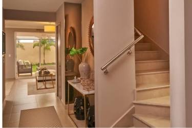Bright dining area with glass doors leading to garden terrace in Bosques del Pacífico, Panama Pacifico