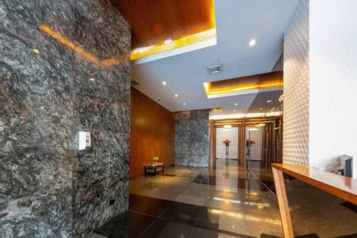 Modern lobby with marble walls, accent lighting, Obarrio Panama City
