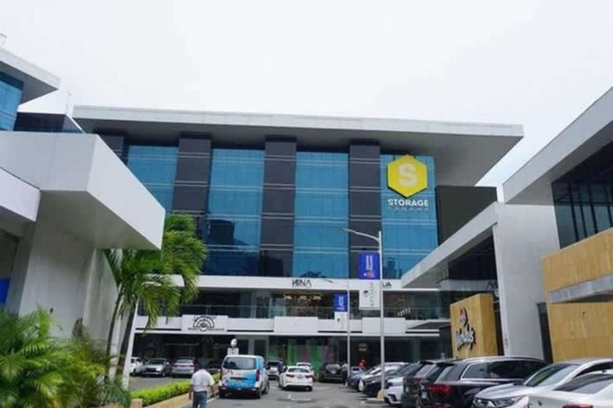 Modern multi-story commercial building with glass facade and parking on Vía Brasil Obarrio Panama City