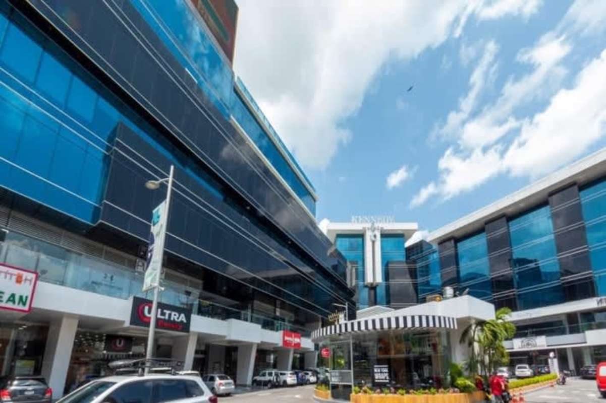 Commercial building with glass facade and parking at Via Brasil Plaza Obarrio Panama City