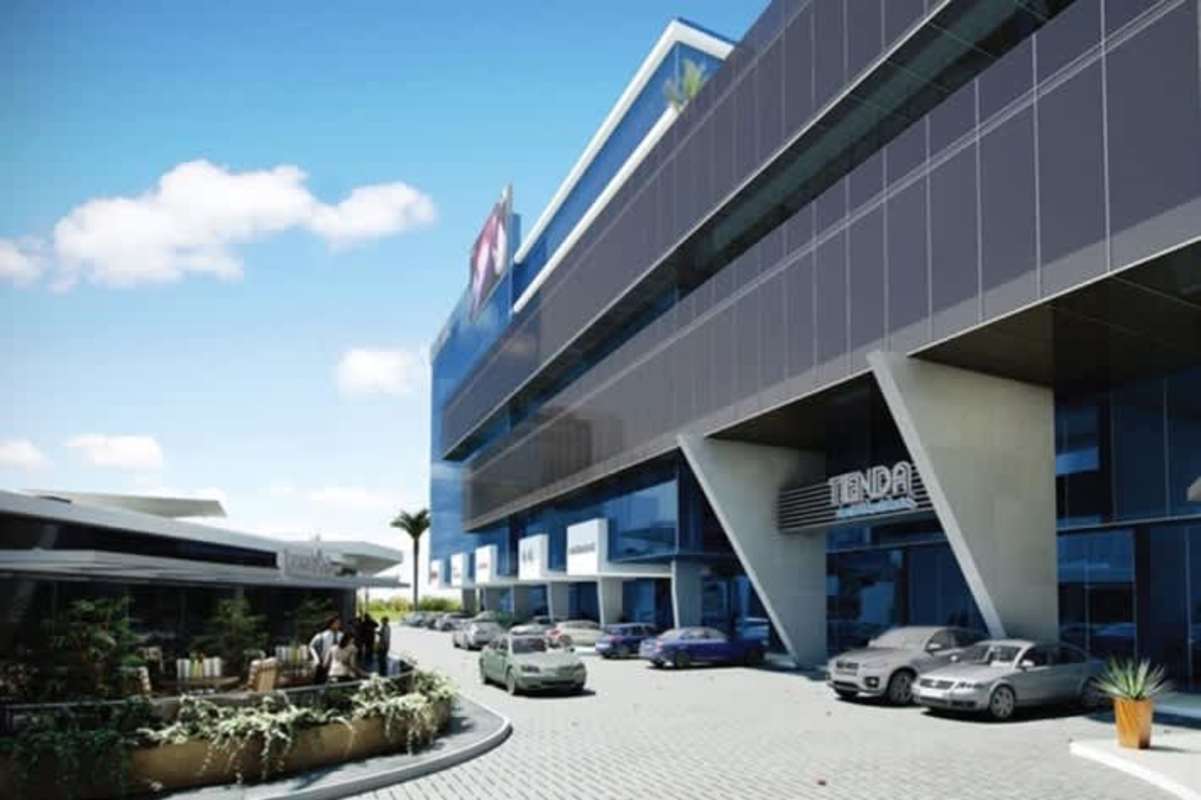 Contemporary commercial building with glass facade, dining space, parking on Via Brasil Obarrio Panama