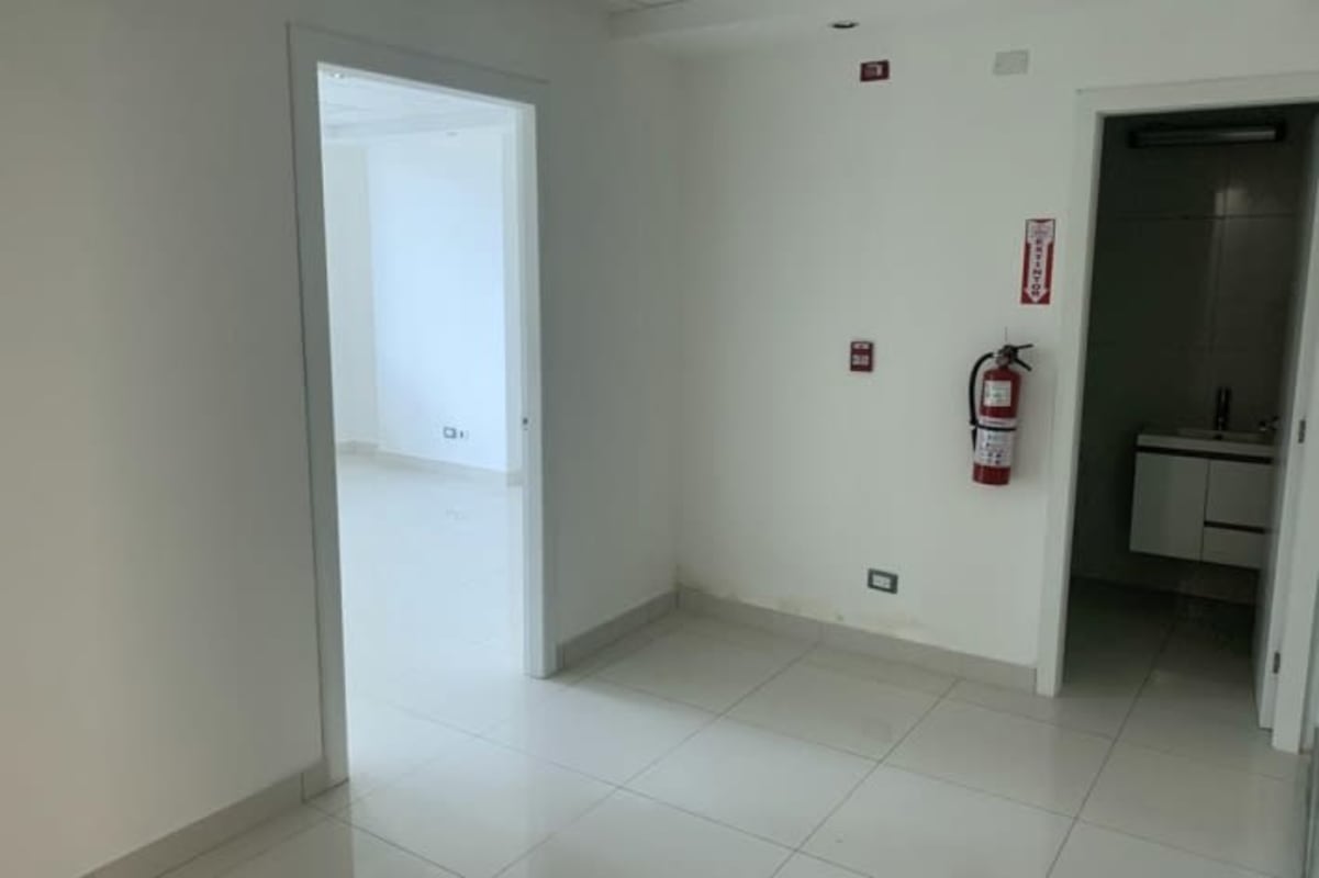 Office room with large window partial ocean and skyline view in PH BICSA Tower Panama City