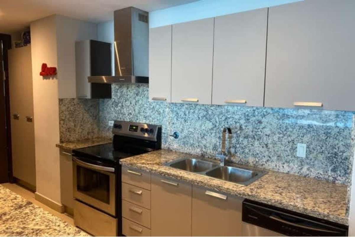 Spacious family-friendly living room with play area at PH Ocean Club Punta Pacifica Panama