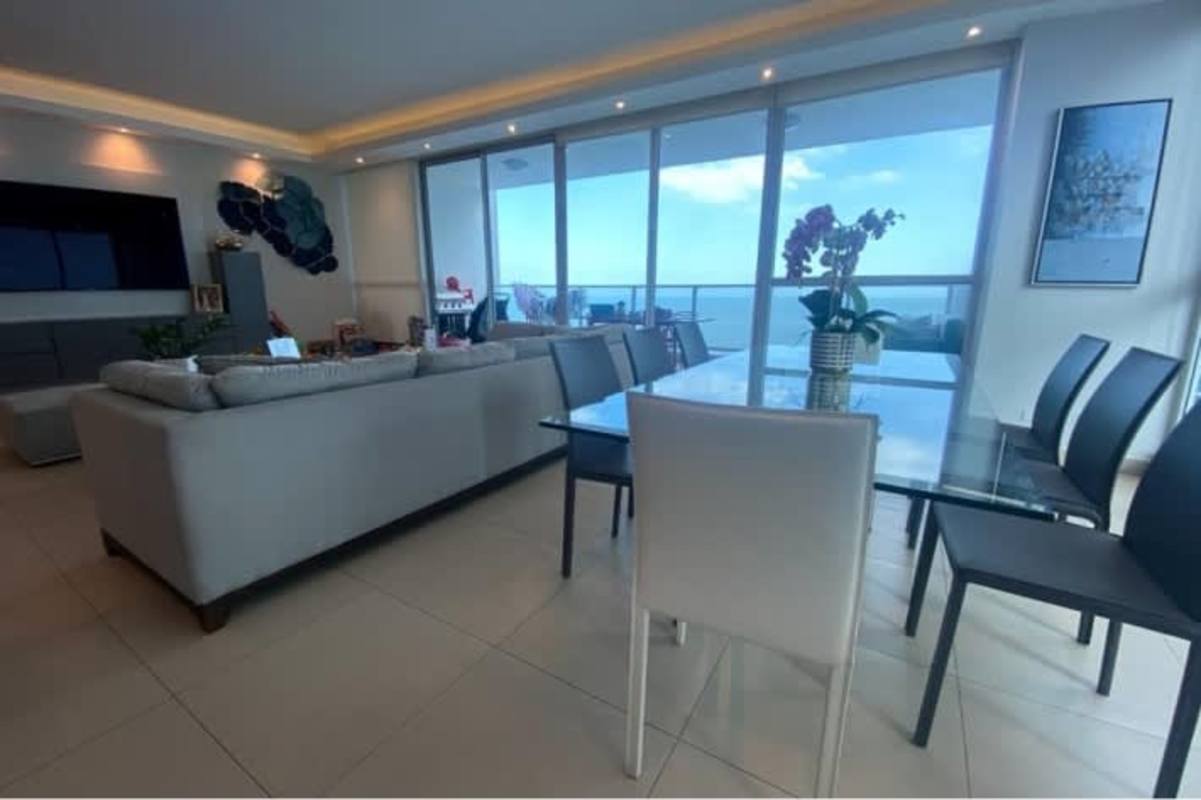 Spacious living and dining room with panoramic ocean views at PH Ocean Club Panama City