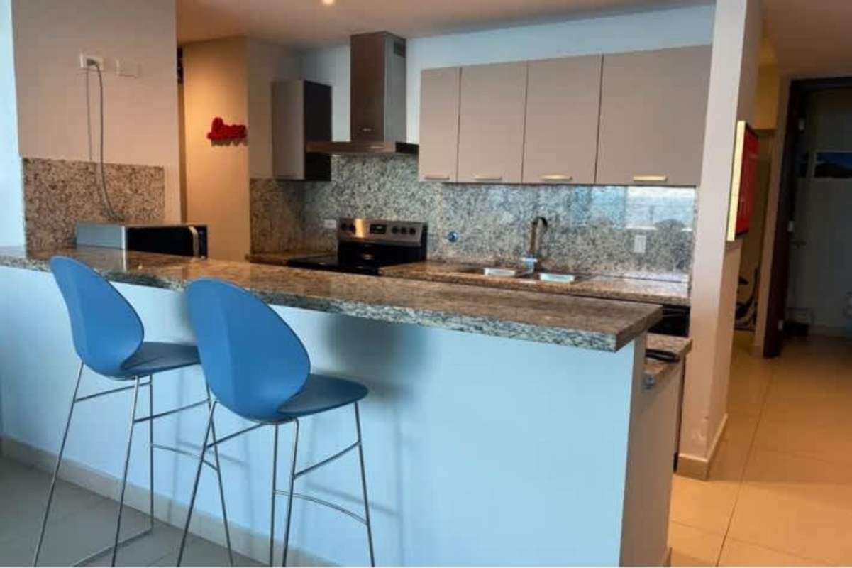 Luxury kitchen with granite countertops and stainless steel appliances at PH Ocean Club Panama City