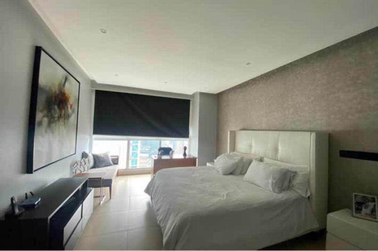 Modern master bedroom with ocean views and natural light in PH Ocean Club Panama City