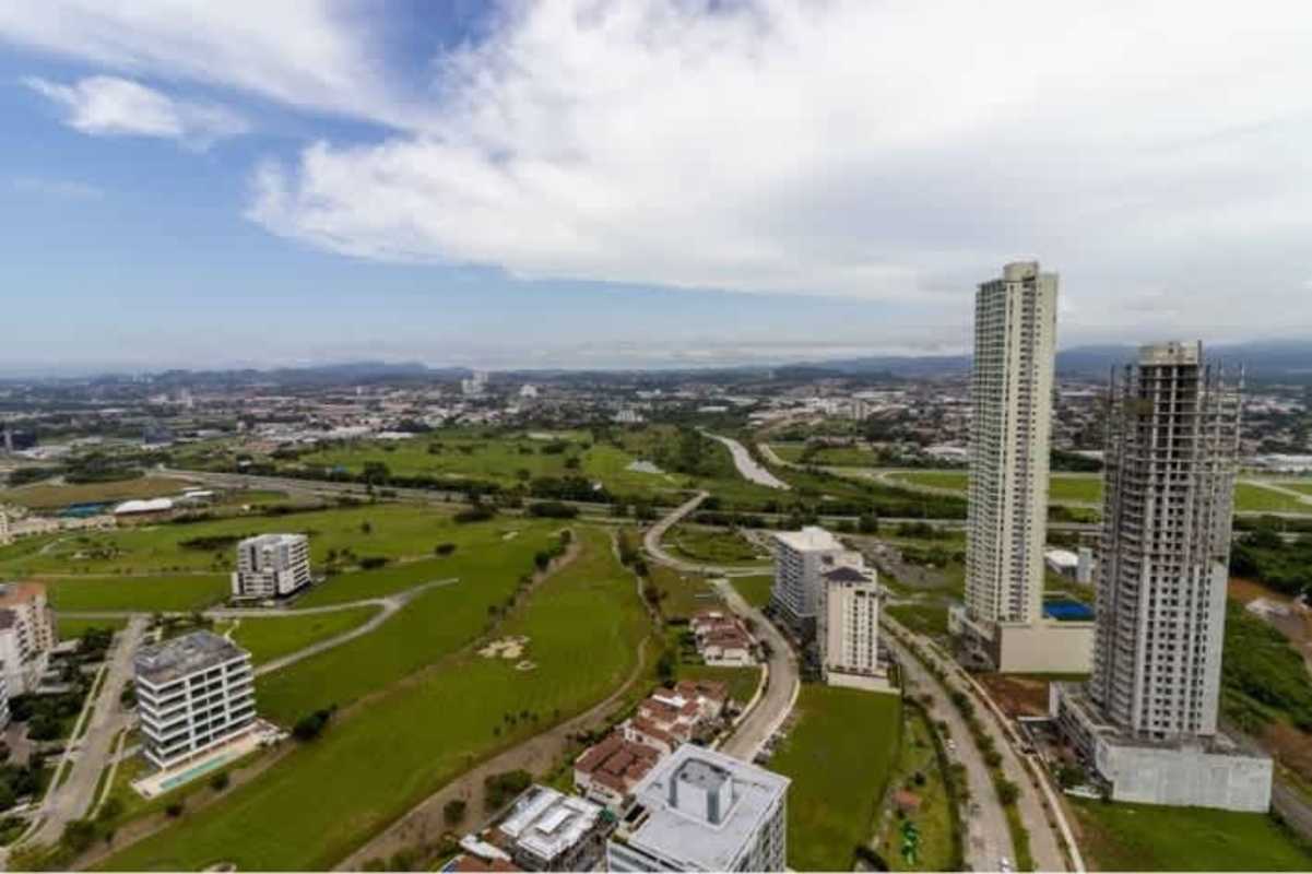 Aerial shot of high-rise condominiums in Santa Maria with green surroundings in Panama City