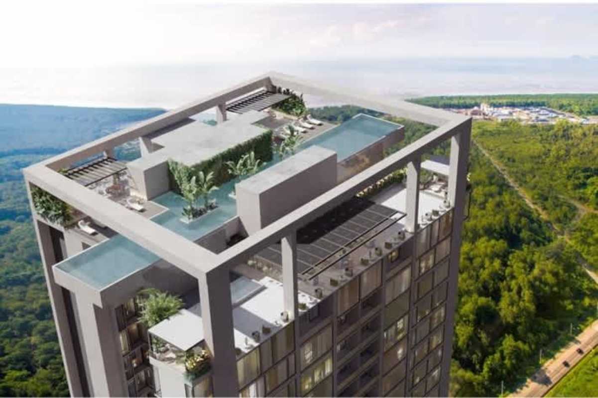 Rooftop terrace with infinity pools and lounge spaces at The Ivy Santa Maria
