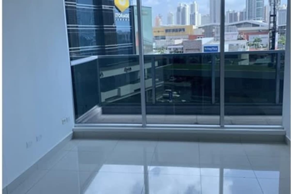 Office hallway with glass partitions at PH Obarrio Business Center, modern commercial building