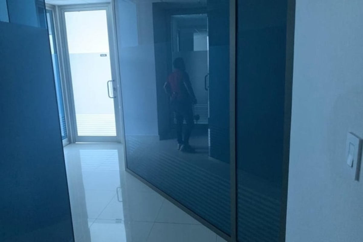 Modern glass partitioned corridor in office space Obarrio Panama