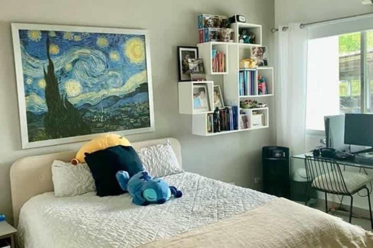 Minimalist bedroom with botanical art, white curtains in La Alameda Betania house Panama