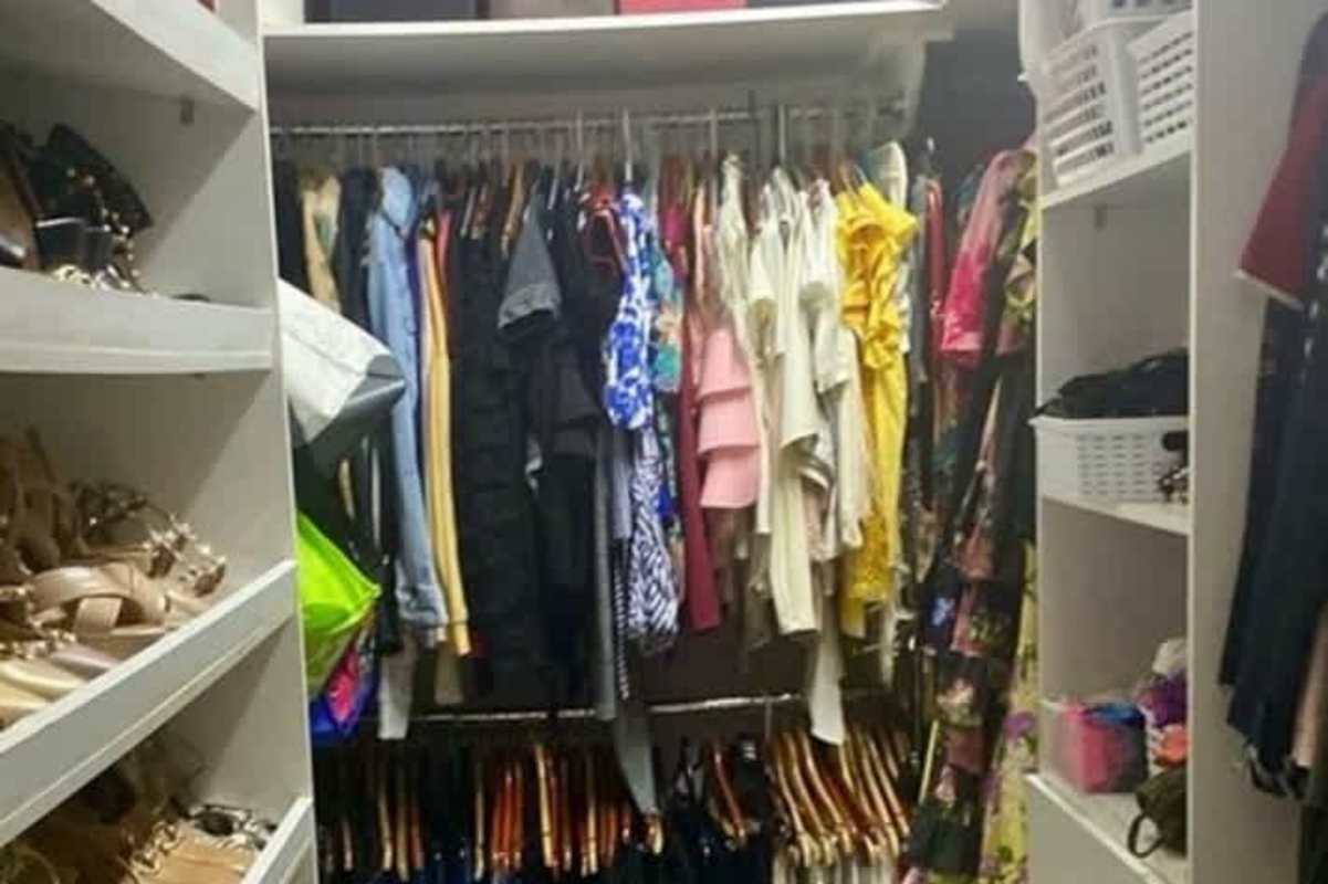 Walk-in closet with ample shelving and hanging space in remodeled Betania Panama house