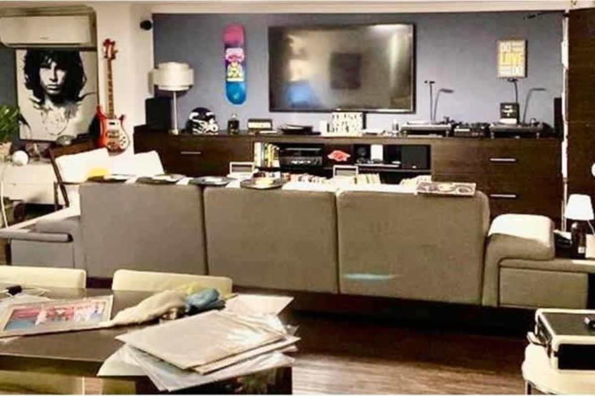 Two-story modern facade with balconies and artificial grass garden at La Alameda Betania Panama City