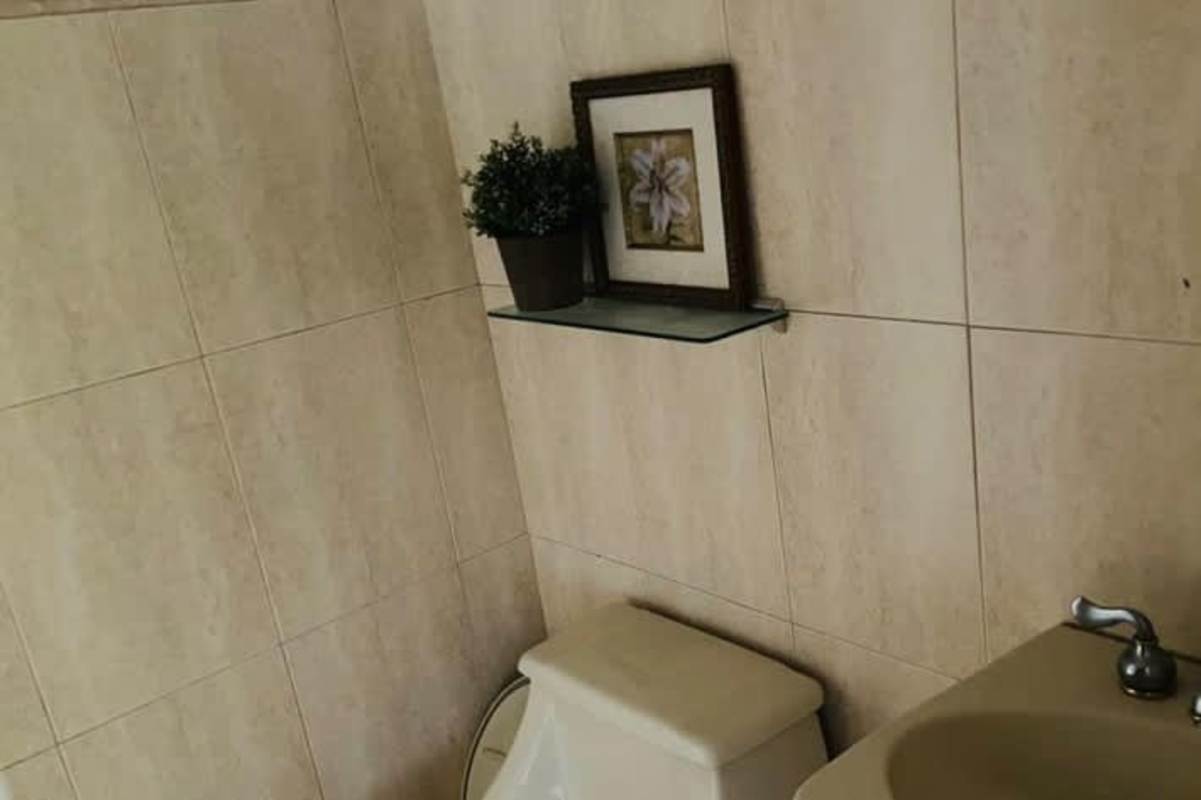 Bright living area with floor-to-ceiling windows panoramic views PH Coco Palace Coco del Mar Panama