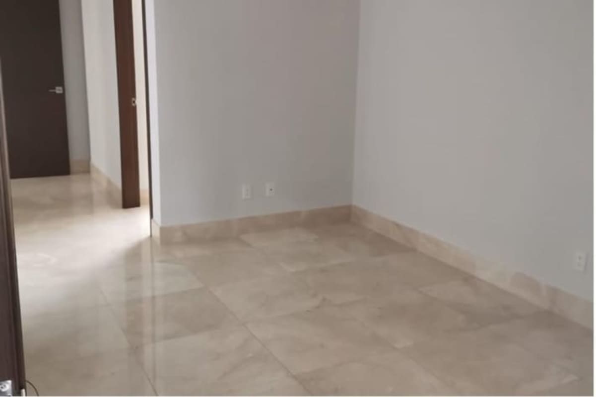 Bright living room with porcelain floors and view to balcony in Santa Maria luxury condo