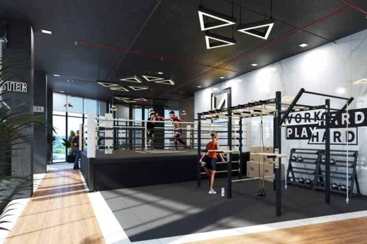 Modern gym with boxing ring, training area, and equipment PH Next luxury condos Panama City