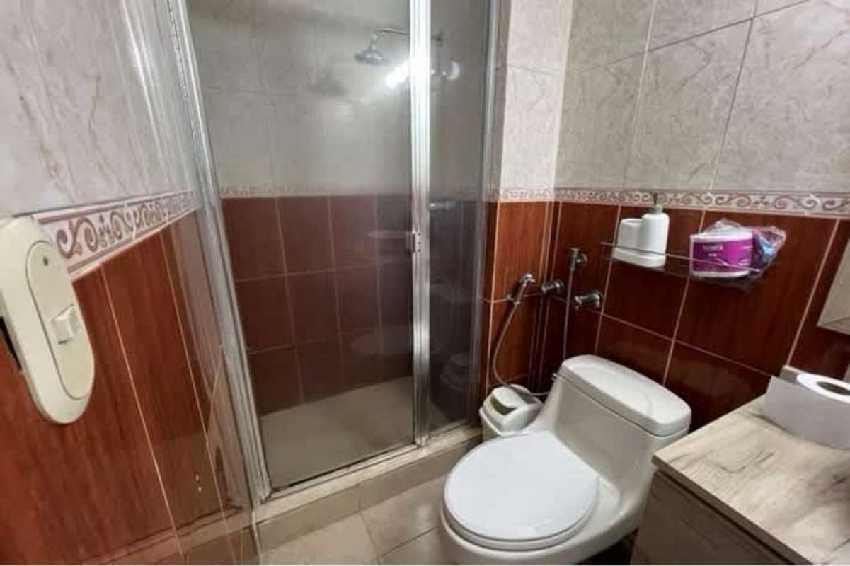 Traditional bathroom with glass shower, vessel sink in PH San Francisco Panama City