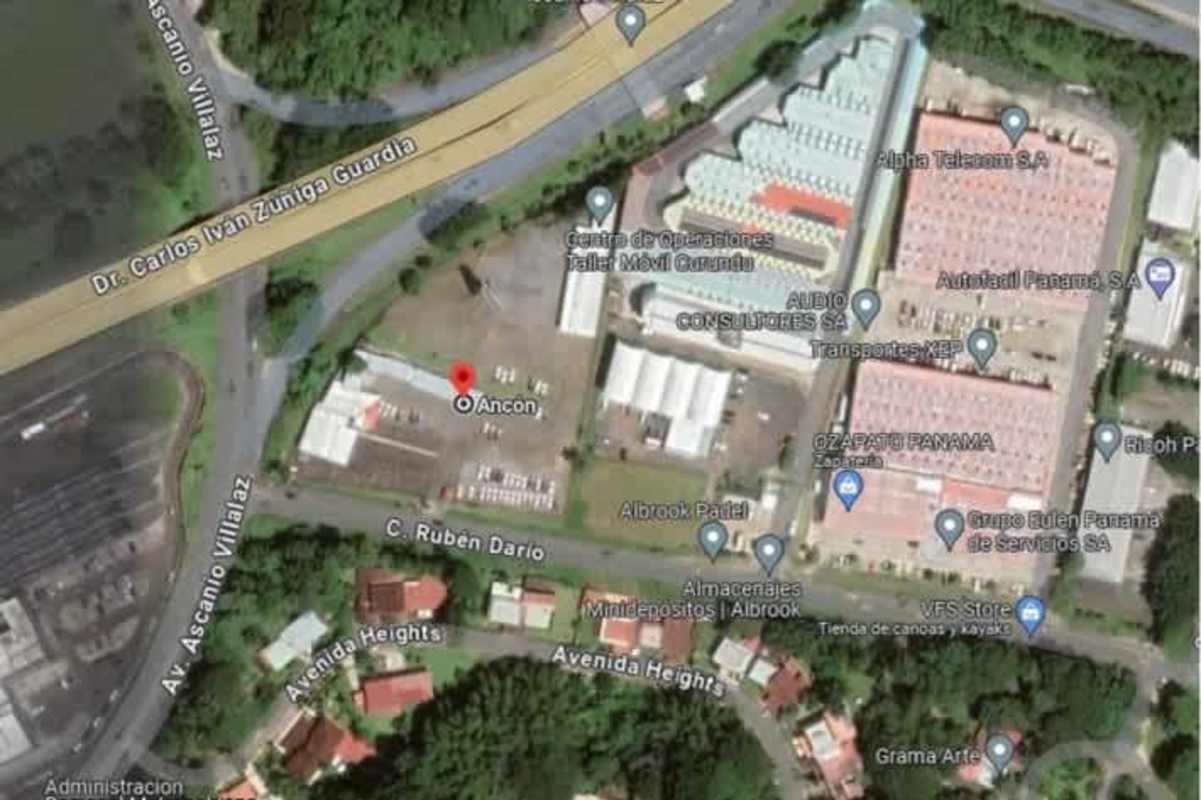 Aerial showing warehouses, commercial area and residential near large land in Albrook