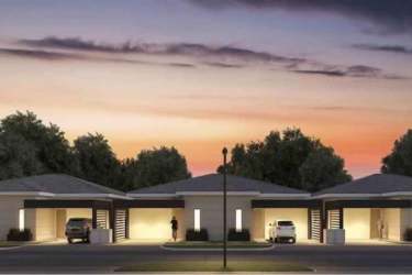 Sunset exterior shot of townhomes with garages in Panama Pacifico