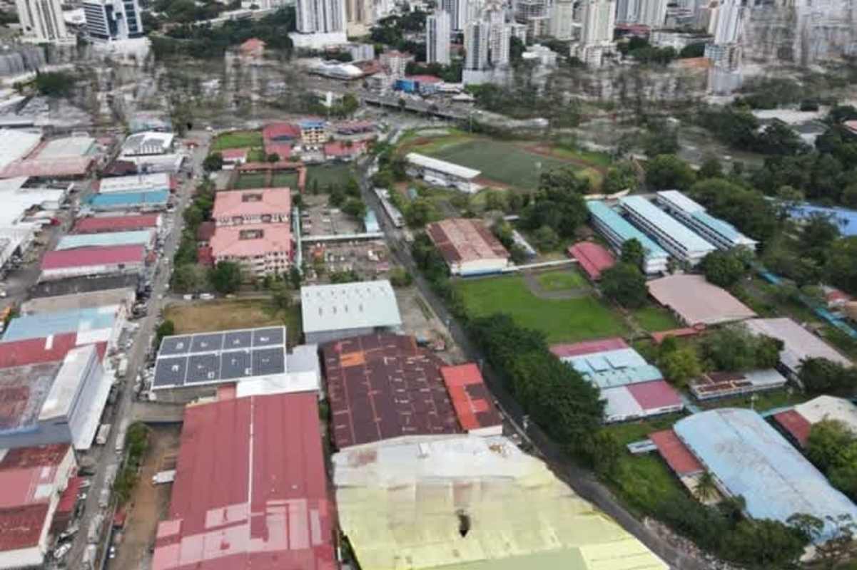 Aerial image showing mixed-use area warehouses residential space sports field Panama City
