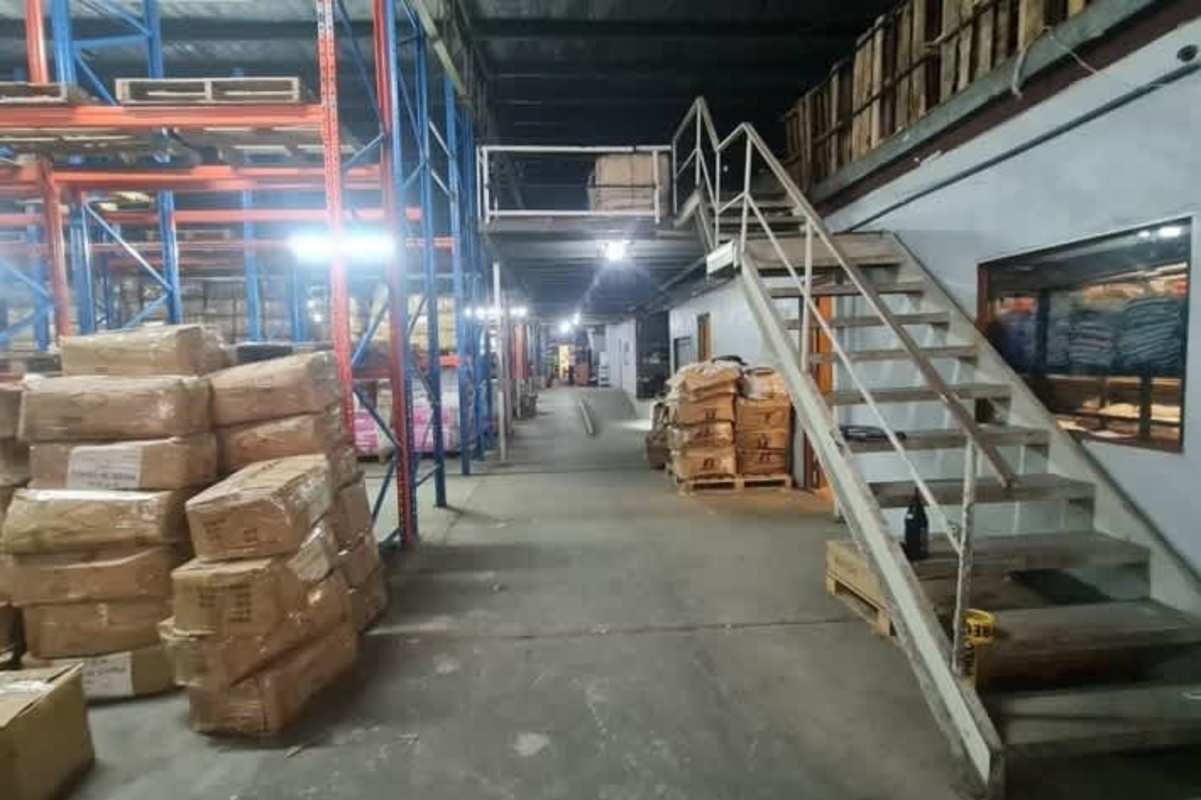 Warehouse interior metal racks mezzanine concrete floor stairs Betania Panama industrial zone