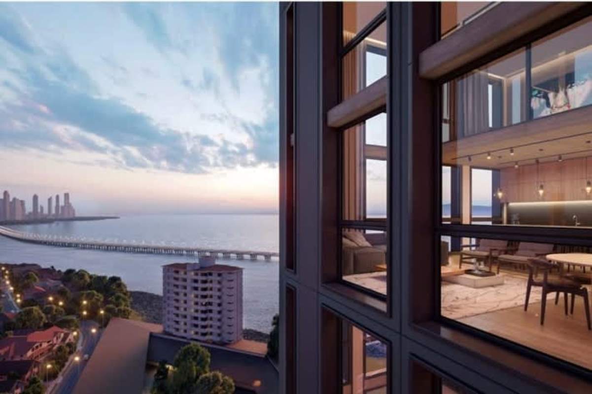 Elegant waterfront condo terrace with patio dining and sunset views Coco del Mar Panama