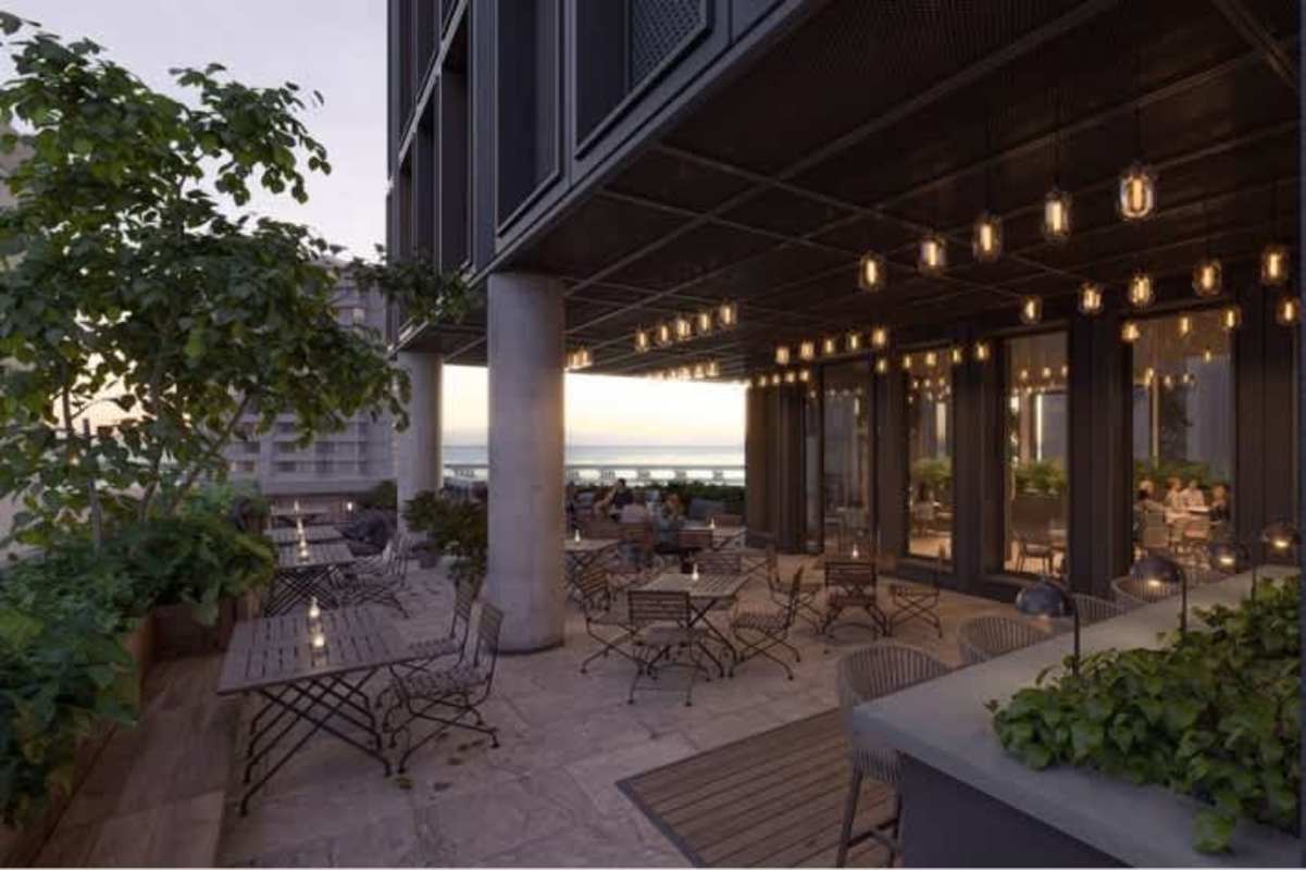 Boutique rooftop infinity pool area with panoramic ocean and skyline views at Coco Place Panama