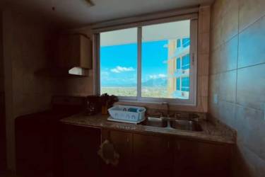 Granite countertop kitchen with dishwasher, double sink, and ocean view in Playa Serena Resort Nueva Gorgona