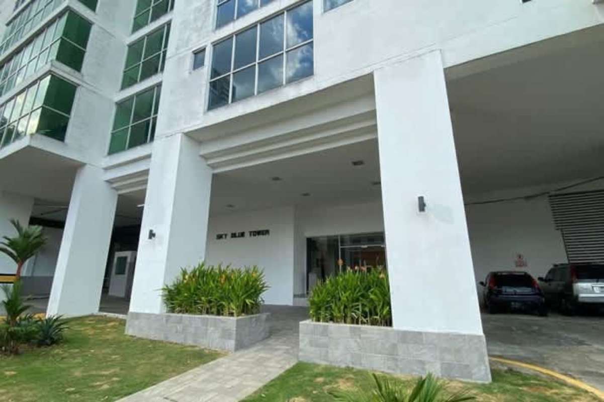 Modern high-rise PH Sky Blue Tower with glass windows, covered parking and landscaping Panama City