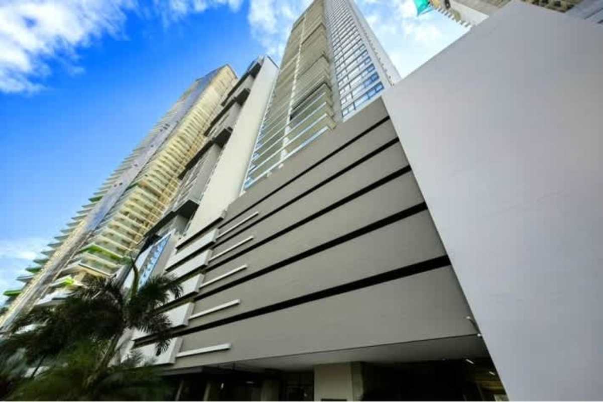 Contemporary kitchen with center island, built-in oven, and sleek cabinets in PH Albatross