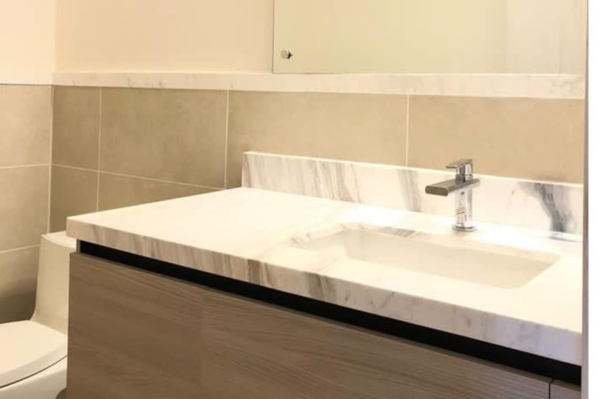 Modern bathroom with glass shower and vanity in PH Oceana Santa Maria Panama