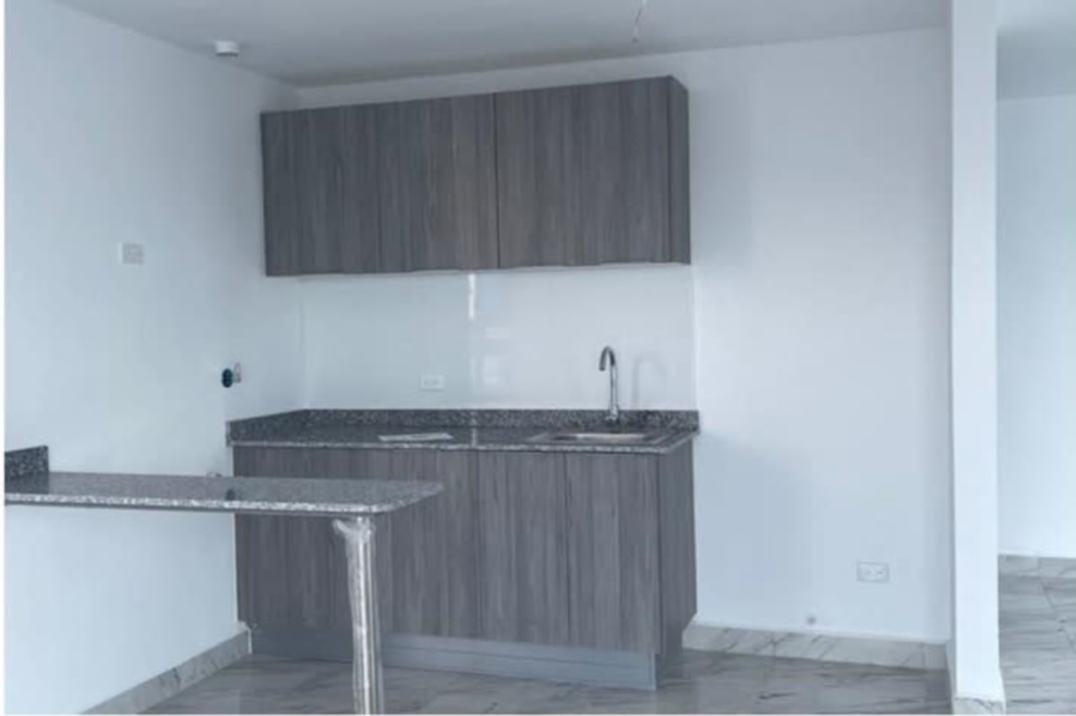 Sleek modern kitchen with granite countertops and breakfast bar in PH The Sands Panama City