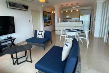 Modern kitchen with granite counters open to dining room PH Coronado Bay