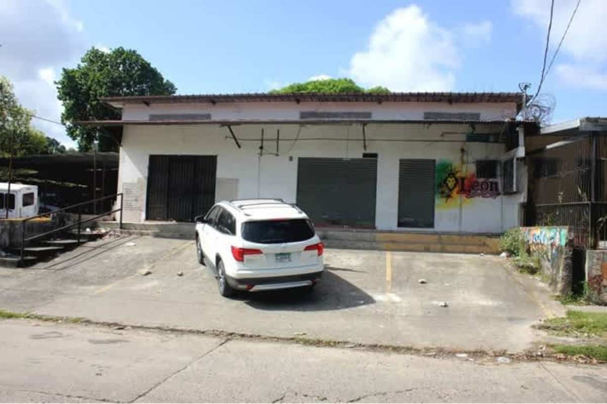 Loading dock with metal ramp and parking area in corner commercial warehouse Panama City