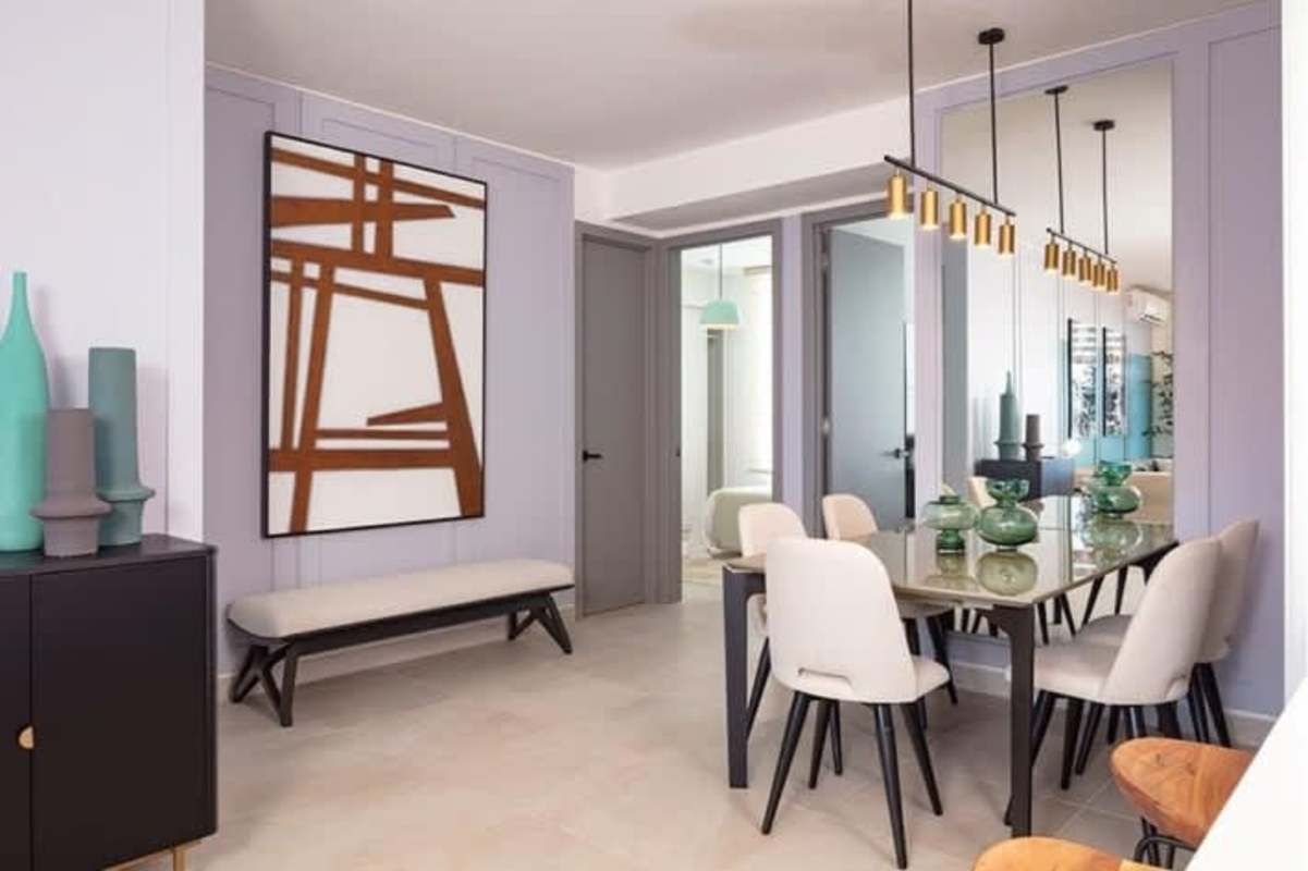 Modern dining room with glass table, pendant lighting and wall art in PH El Cangrejo 1052