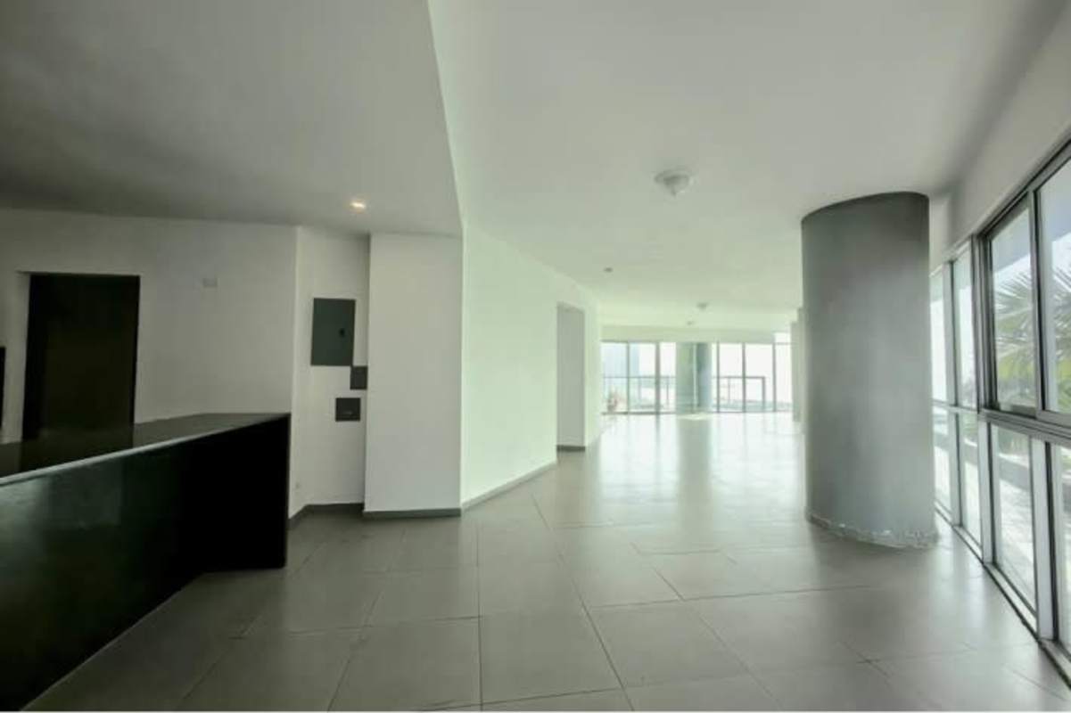 Contemporary open kitchen with island, granite tops, and expansive water views at PH Yacht Club Panama City