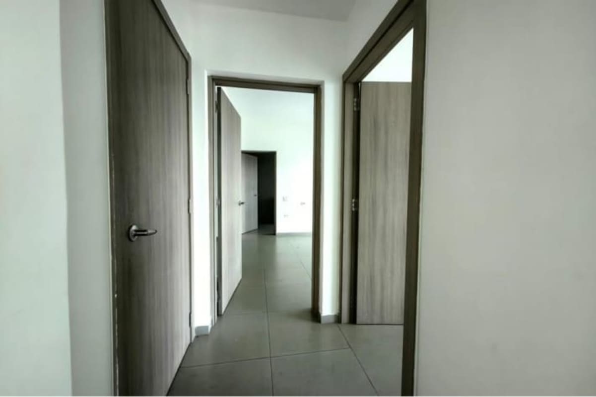 Elegant master bathroom with dual sinks, large mirror, glass shower, natural light in PH Yacht Club Panama City