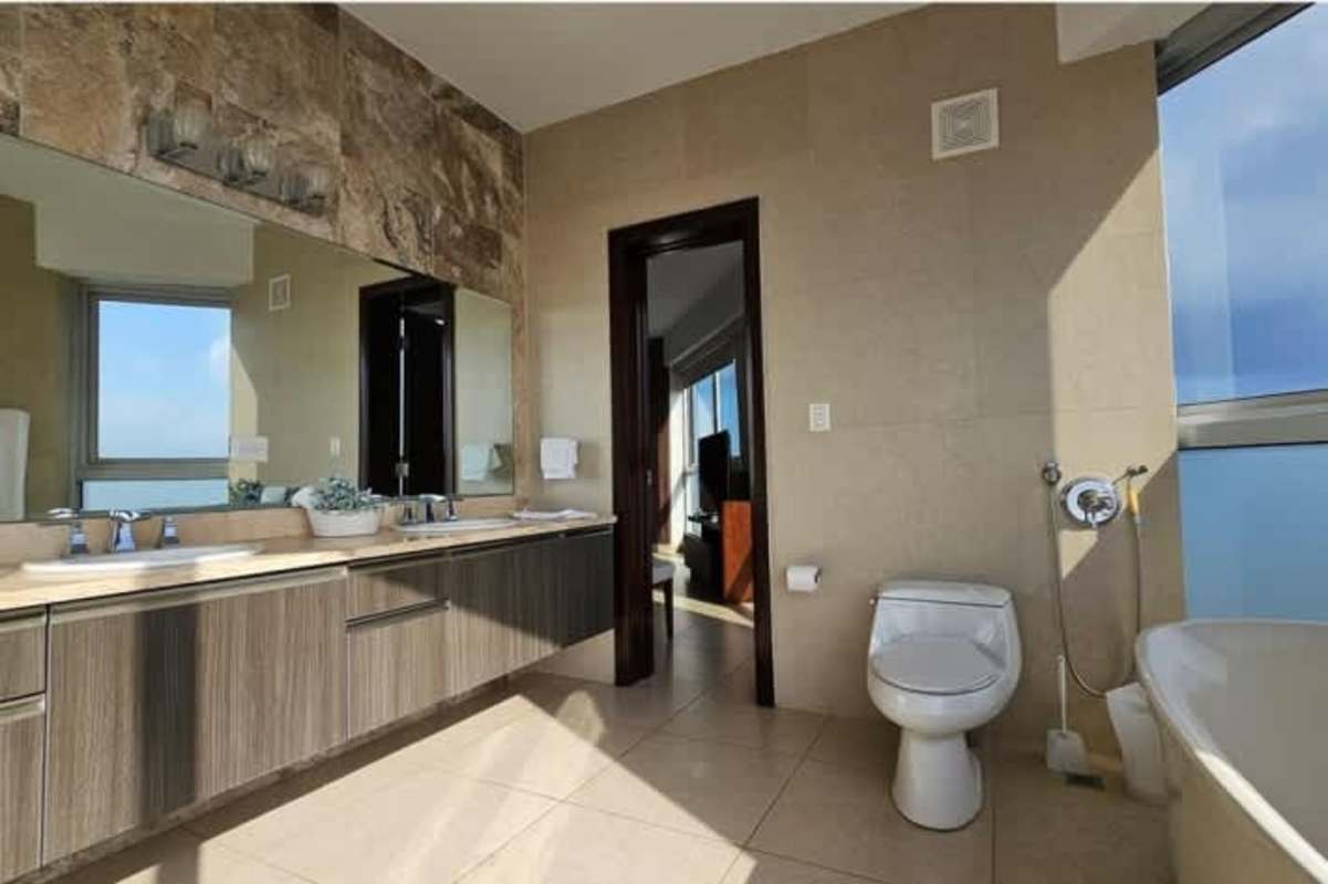 Spacious oceanfront living dining area with floor-to-ceiling windows PH Rivage Panama