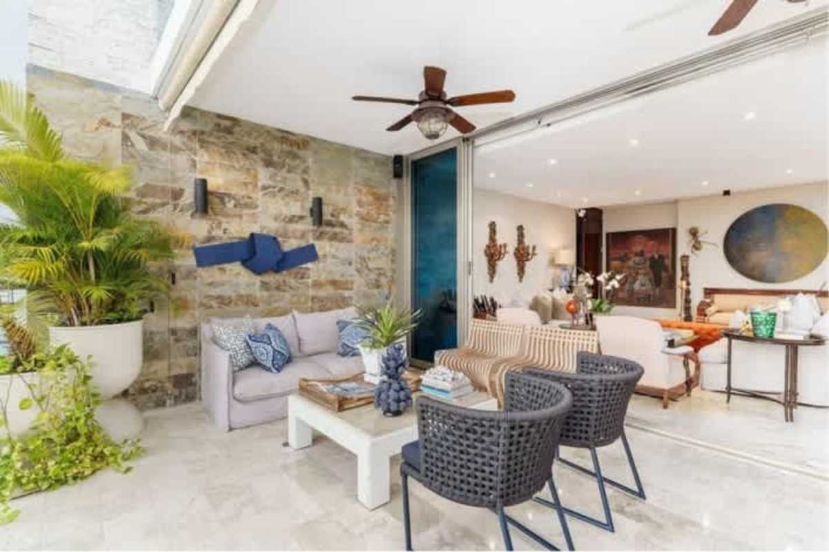 Modern open interior living area with marble floors and access to terrace in PH Aquamar