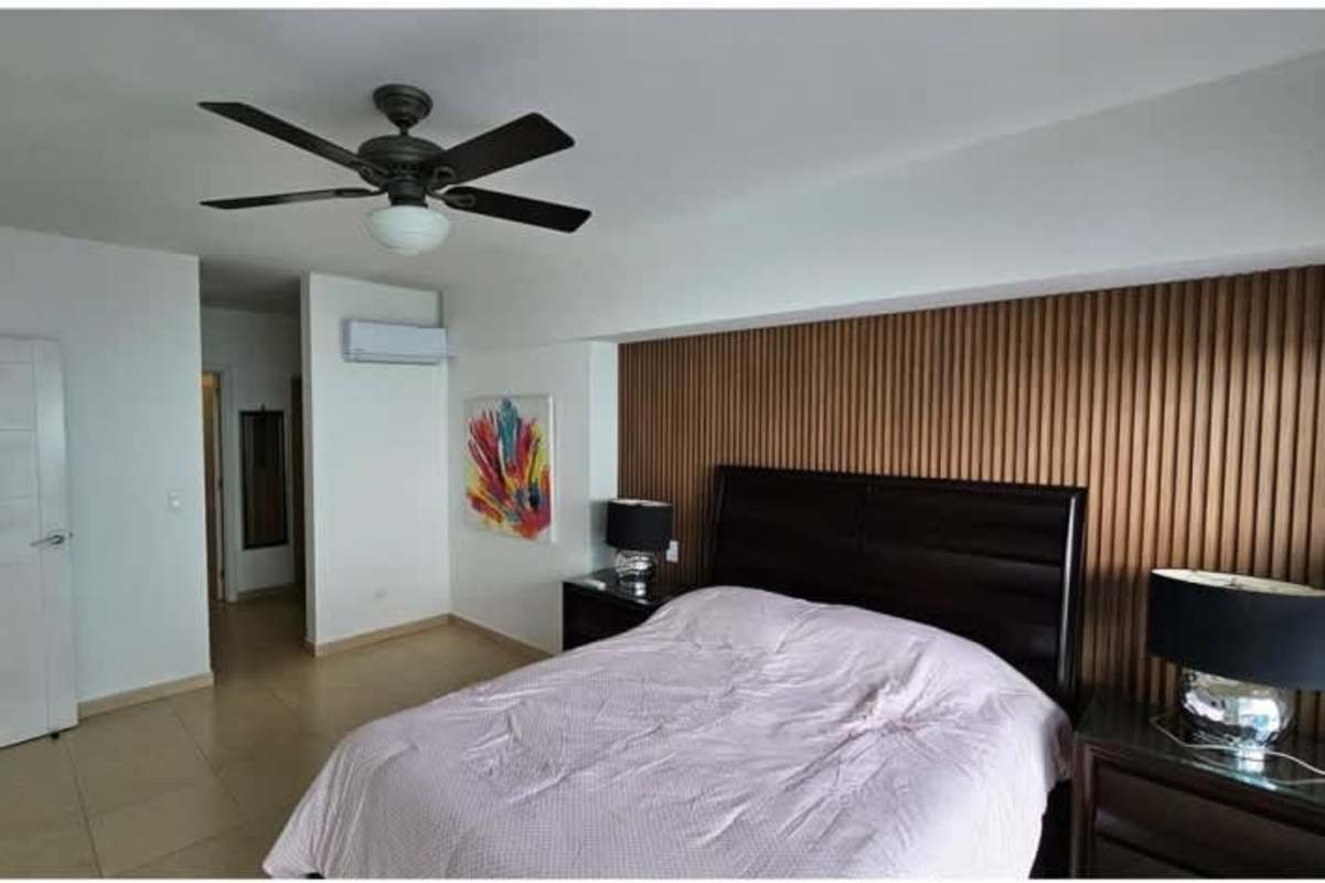 Spacious master bedroom with balcony access and stunning ocean view PH Waters on the Bay Panama City