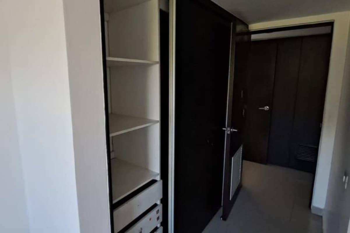 Apartment kitchen with granite countertops and cabinetry in PH Altamira Gardens Panama