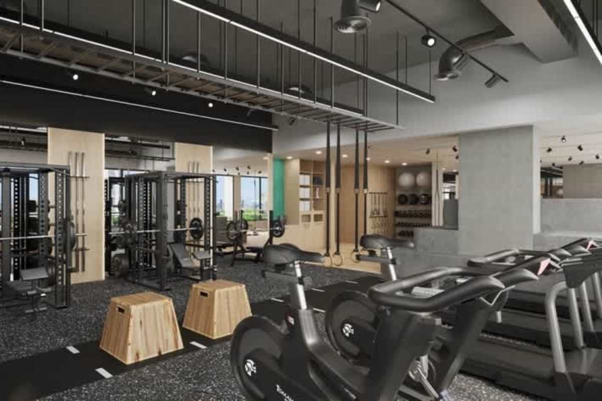 Modern gym with workout equipment cardio zone weight racks Coco del Mar Tower