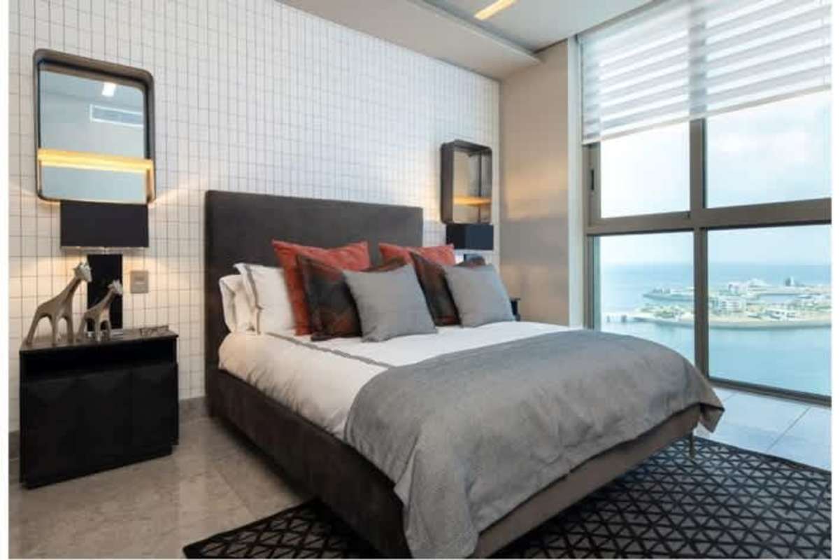Modern bedroom ocean and skyline views floor to ceiling windows PH Pacific Point