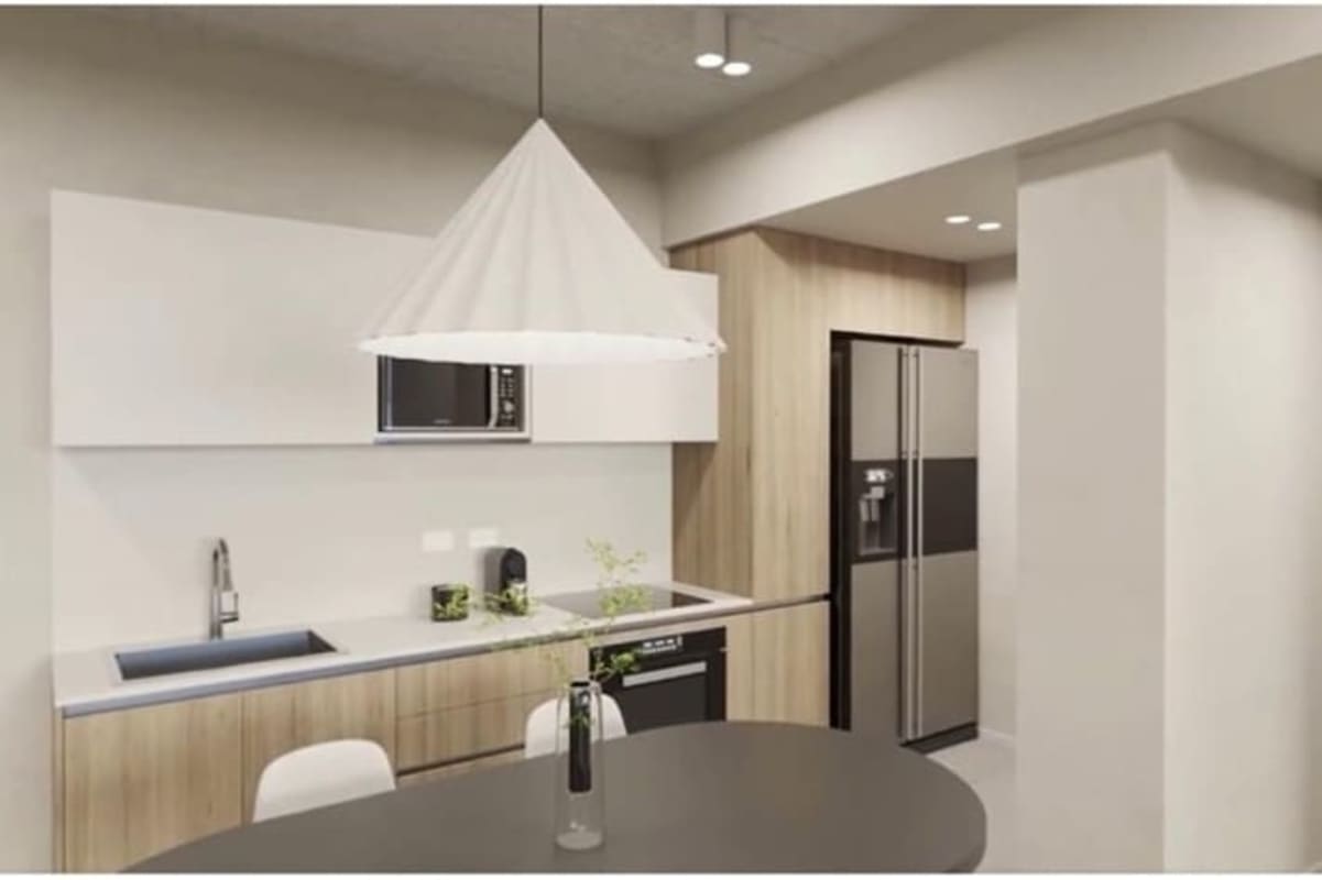 Minimalist open kitchen with built-in cabinetry and appliances PH Coco del Mar Panama