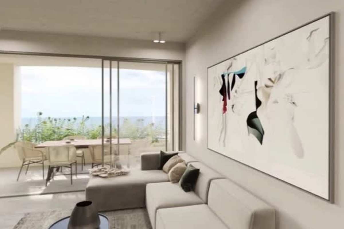Modern living room in PH Coco del Mar apartment with sliding doors to terrace ocean view