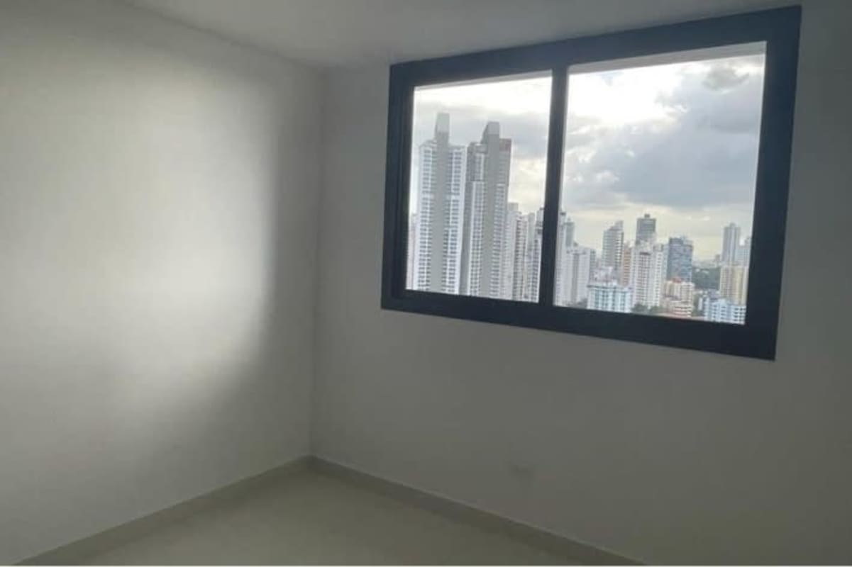 Open plan living dining area with access to private balcony and city views in PH El Cangrejo Panama