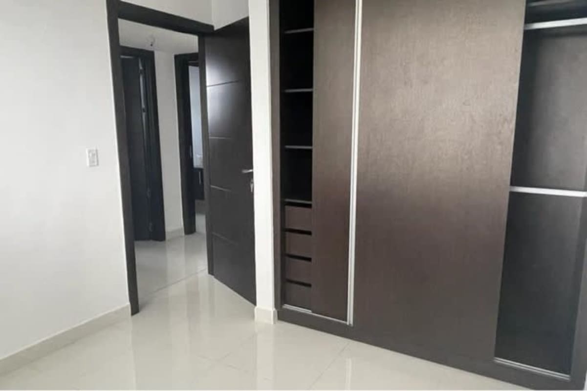 Private balcony with glass railing offering panoramic skyline views of Panama City in PH El Cangrejo Panama