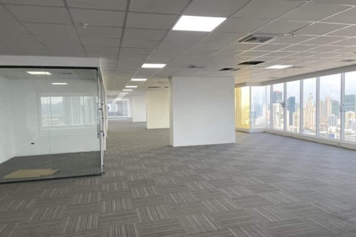 Modern corridor leading to multiple elevators in PH BICSA Tower Panama