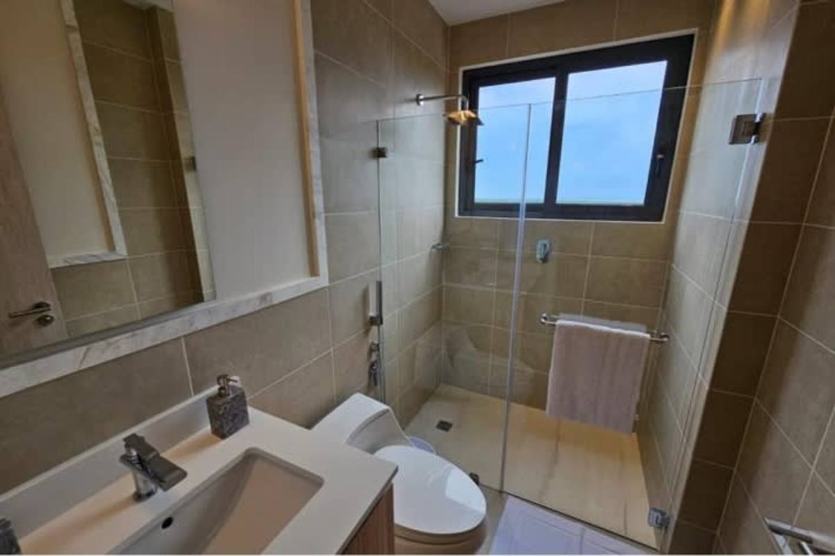 Modern master bath with glass shower Santa Maria Golf apartment Panama
